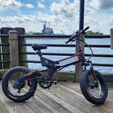 EZ Elecric Bike Rentals image of new 20" fat tire e-bike sitting on the Wilmington Riverwalk